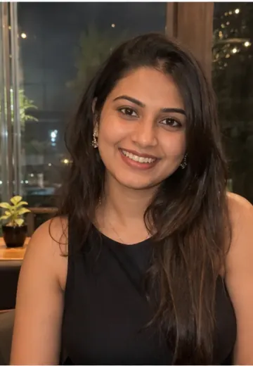 Zara smiling in a Hyderabad cafe profile photo